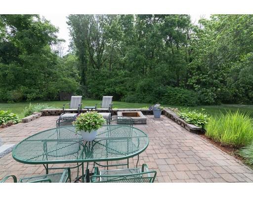 23 Hawthorne Road Ashland, MA 01721 - Photo 33 of 41 a view of a chairs and table in the garden