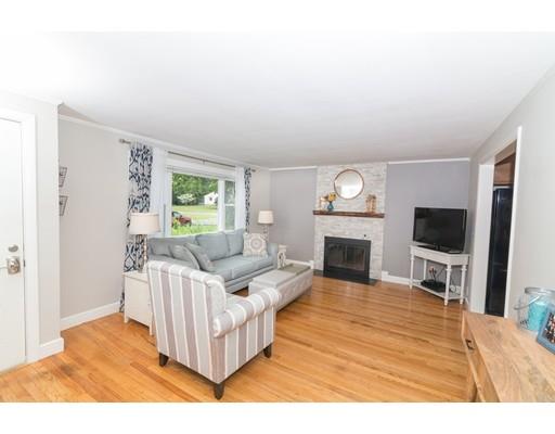23 Hawthorne Road Ashland, MA 01721 - Photo 4 of 41 a living room with furniture a fireplace and a flat screen tv
