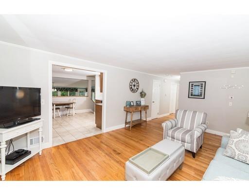 23 Hawthorne Road Ashland, MA 01721 - Photo 8 of 41 a living room with furniture and a flat screen tv