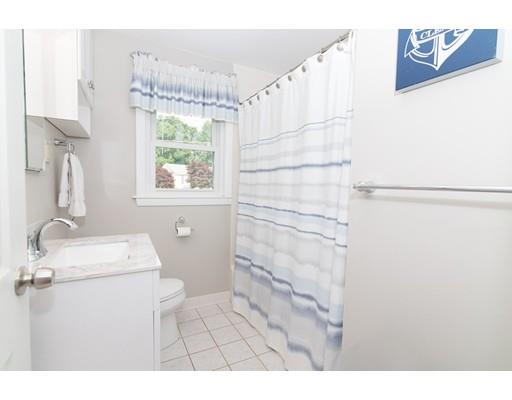 23 Hawthorne Road Ashland, MA 01721 - Photo 9 of 41 a bathroom with a sink a mirror and a shower