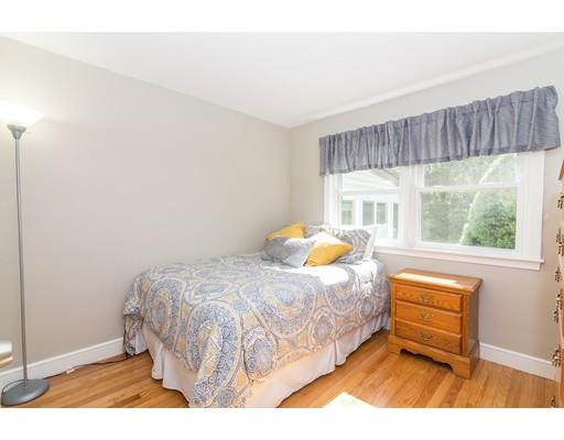 23 Hawthorne Road Ashland, MA 01721 - Photo 10 of 41 a bedroom with a bed and wooden floor
