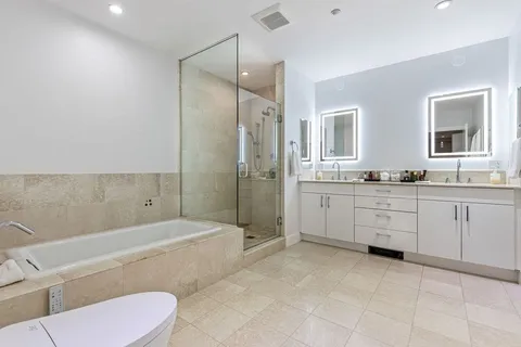a bathroom with a sink a toilet and bathtub