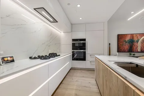 a kitchen with a stove and a sink