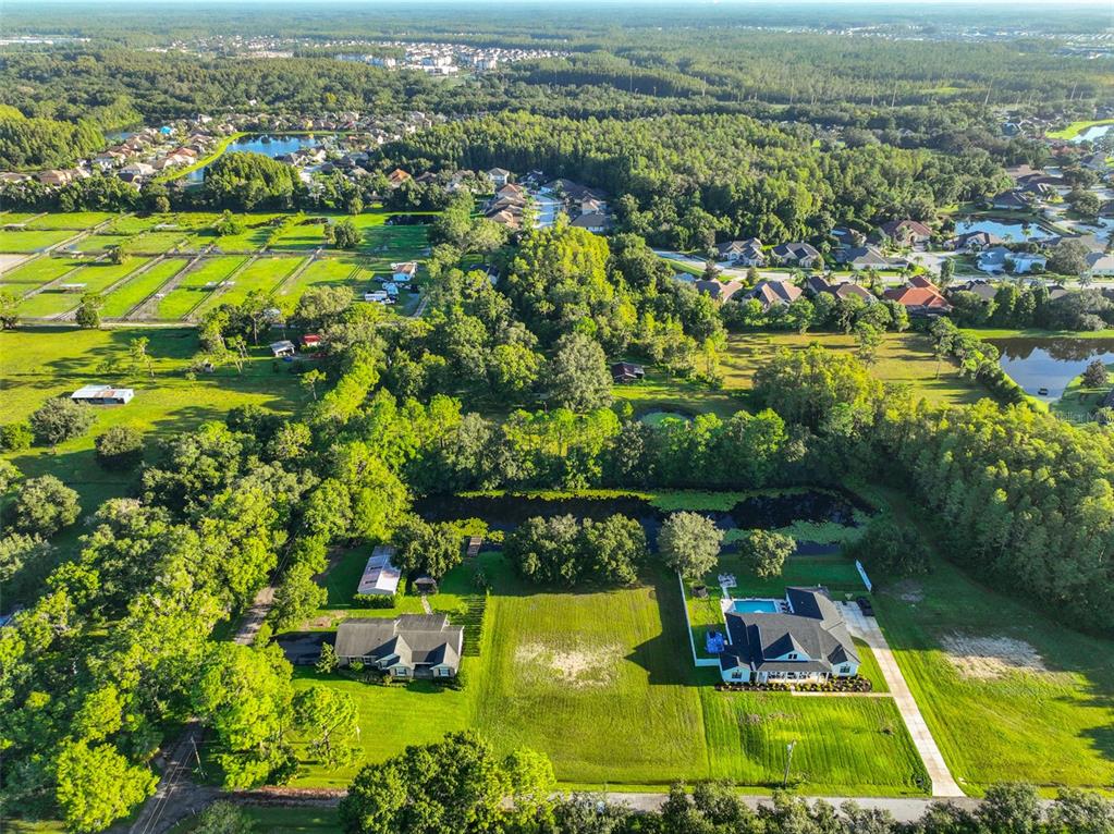 0 Phillips Road, Unit 2 Odessa, FL 33556 - Photo 12 of 22 an aerial view of residential houses with outdoor space and swimming pool