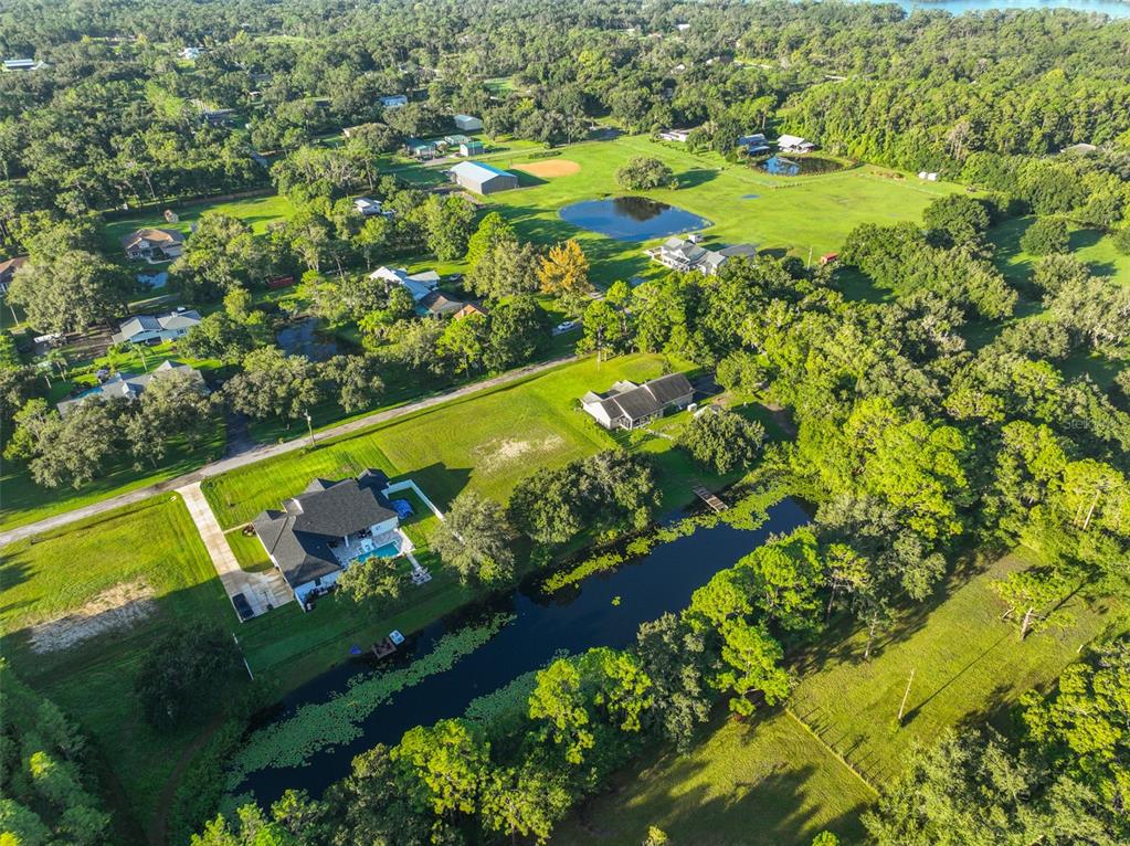0 Phillips Road, Unit 2 Odessa, FL 33556 - Photo 19 of 22 a view of a pool with plants and garden
