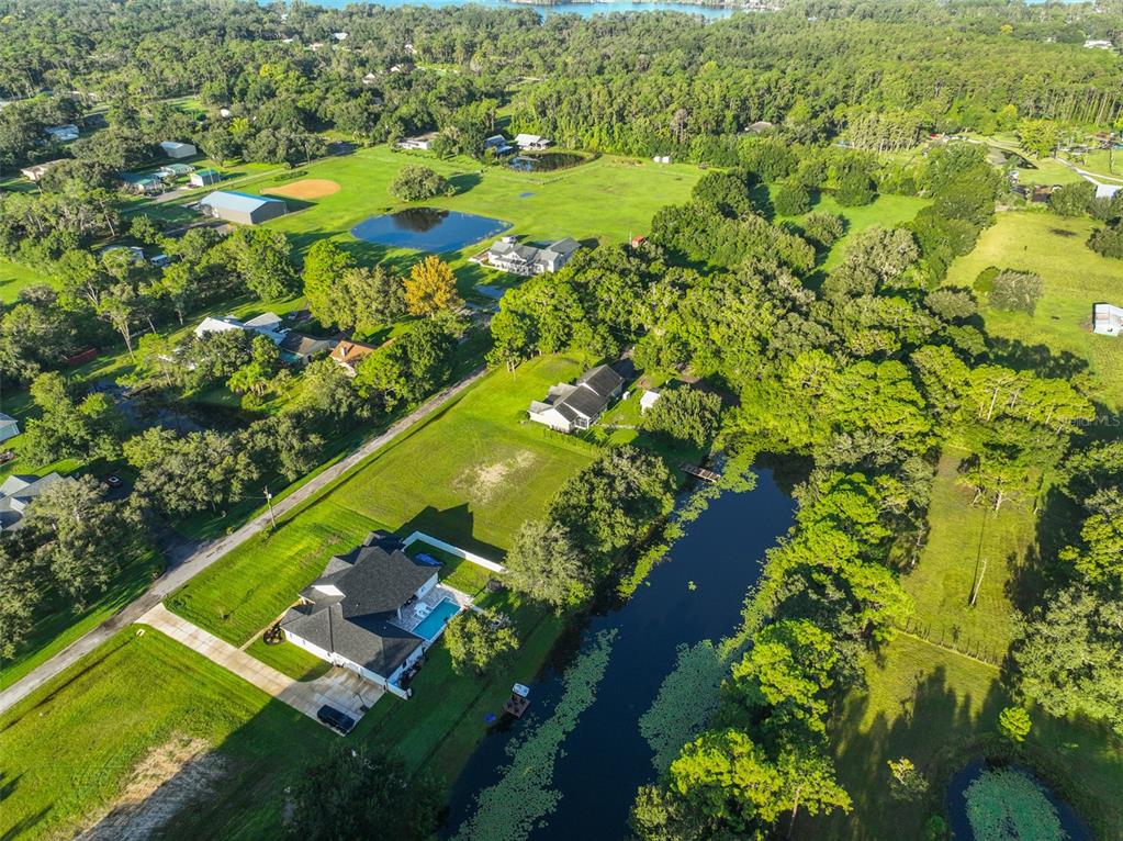 0 Phillips Road, Unit 2 Odessa, FL 33556 - Photo 20 of 22 a view of a lake with a yard