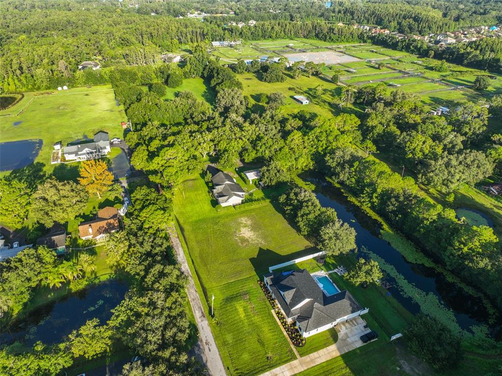 0 Phillips Road, Unit 2 Odessa, FL 33556 - Photo 22 of 22 an aerial view of a residential houses with yard