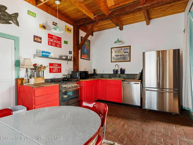 a outdoor living space with patio furniture and a large window