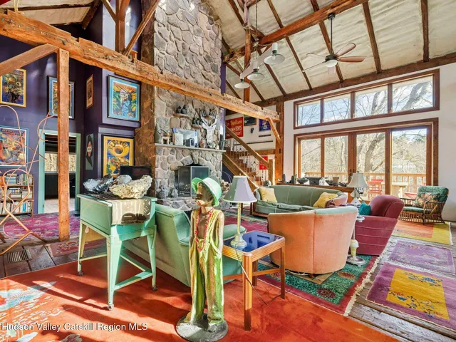 a outdoor living space with furniture and a fireplace