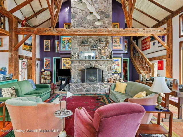 a view of a roof deck with furniture