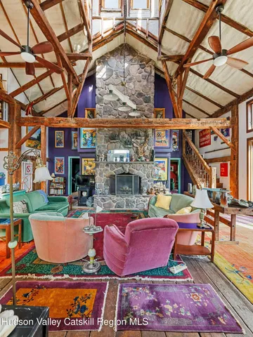 a bathroom with a sink mirror toilet and window