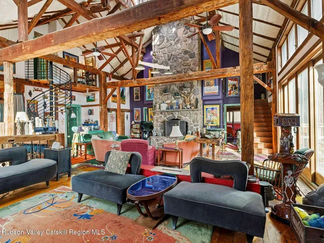 a backyard of a house with sofas and furniture