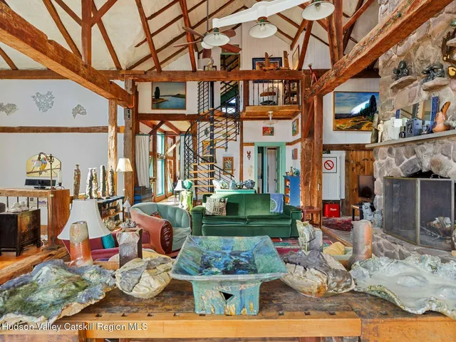 a living room with furniture a rug and a window