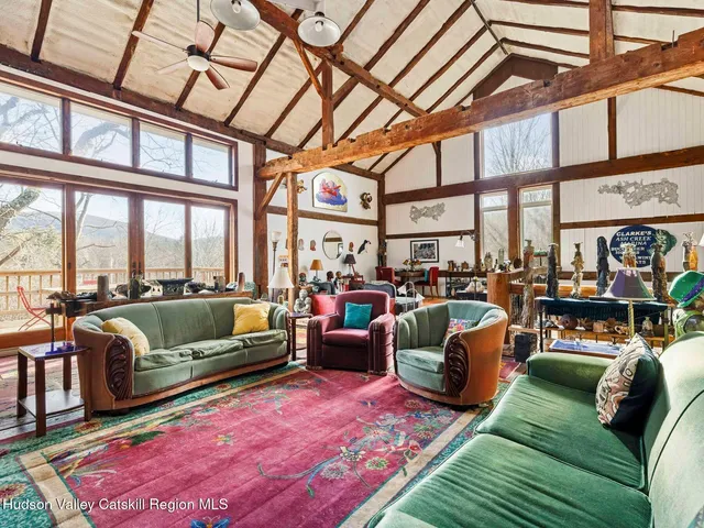 a bedroom with furniture and a fireplace