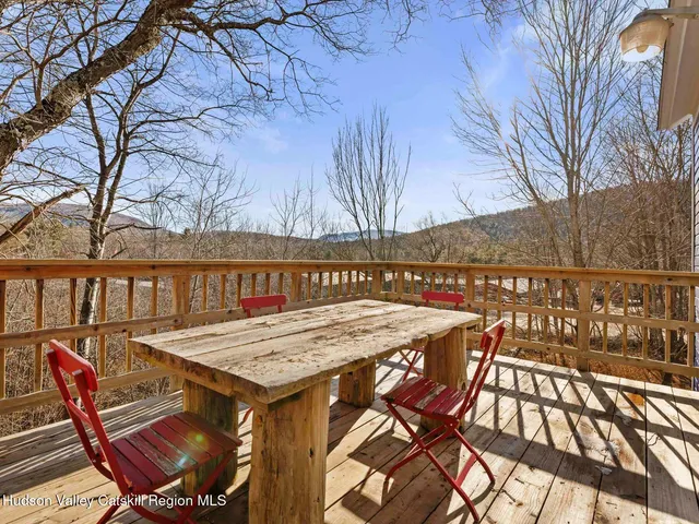 a bedroom with furniture and a book shelf