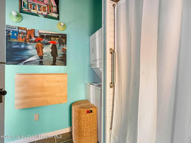 a view of a room with furniture and windows