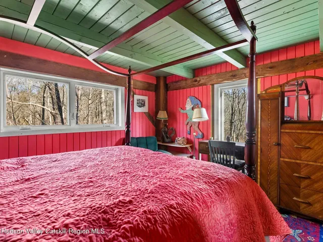 a view of a grassy field with trees