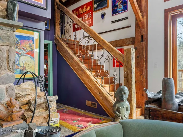 a view of a big yard with plants and large trees