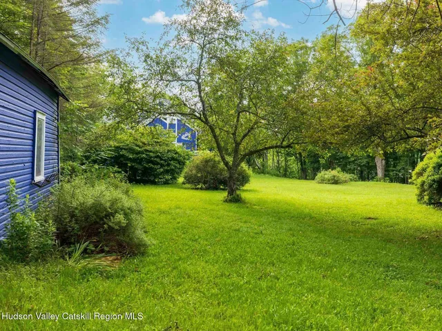 a backyard of a house with seating space