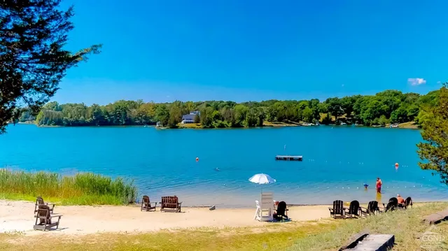 a view of a swimming pool with a lake view