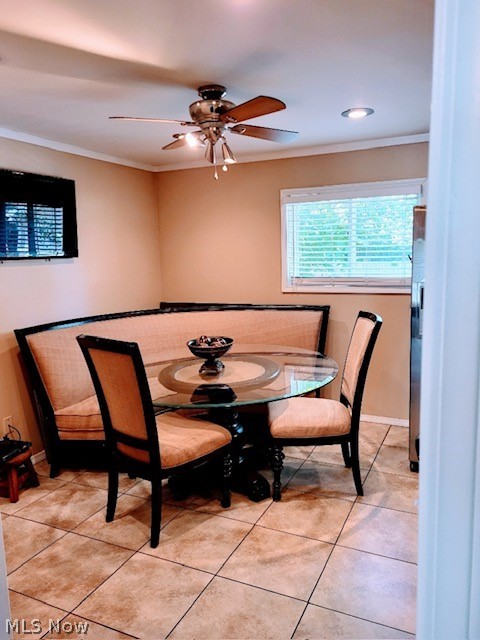 3741 Grosvenor Road Cleveland, OH 44118 - Photo 18 of 32 Dining room featuring ceiling fan, crown molding, and light tile floors