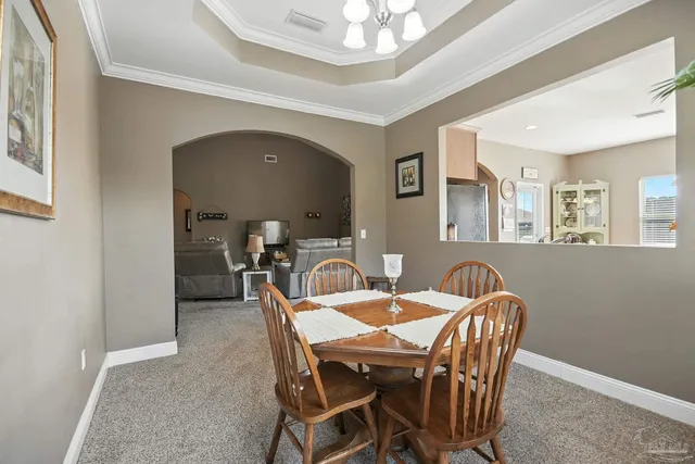 a view of a a dining room with furniture