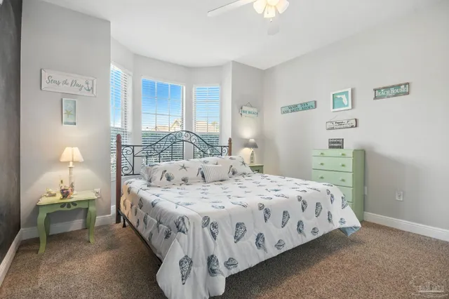 a bedroom with a bed and lamp