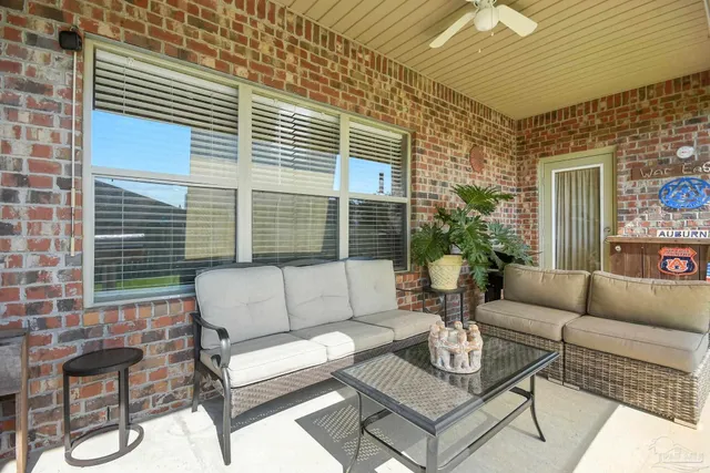 a outdoor living space with furniture and a potted plant