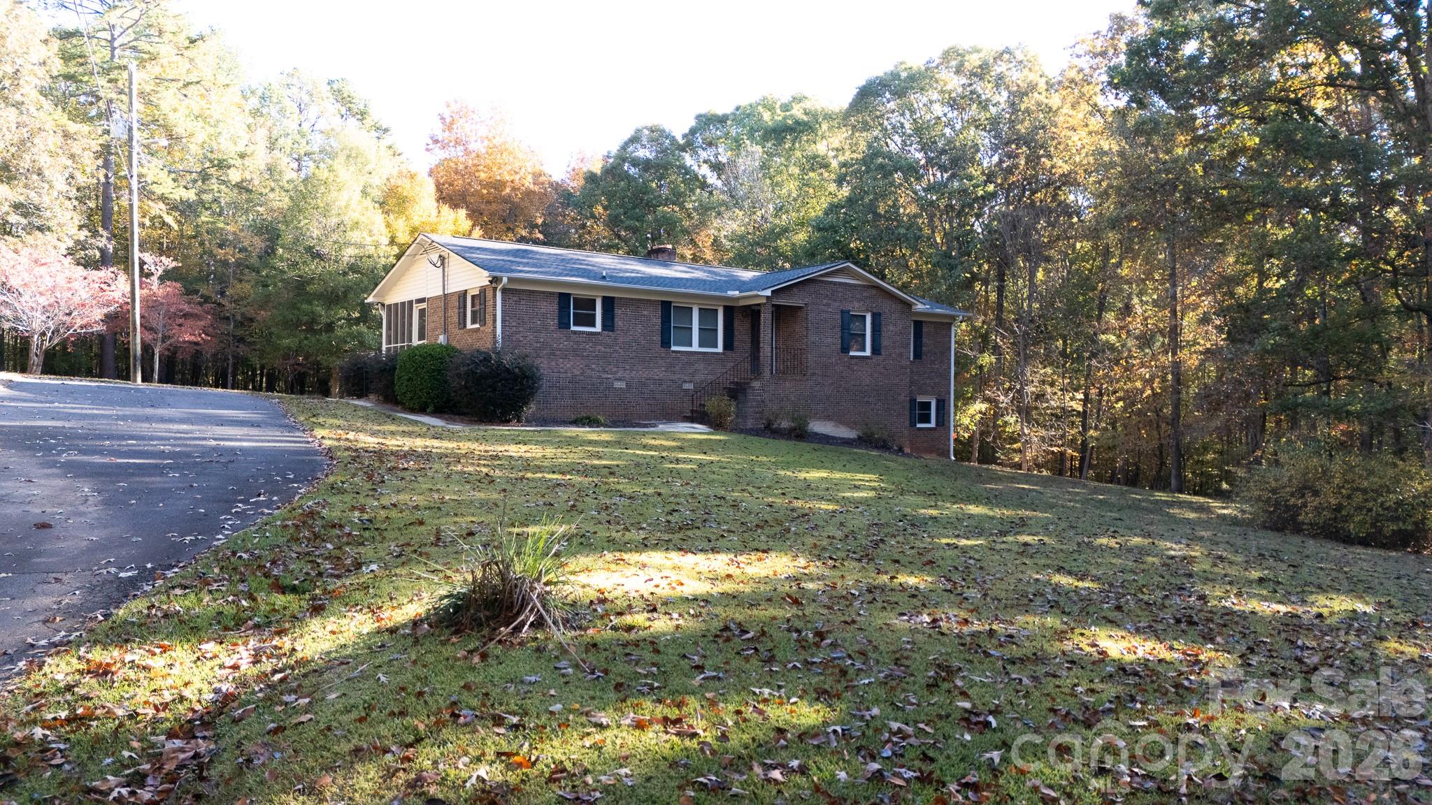4193 Walker Road Rock Hill, SC 29730 - Photo 33 of 38 a view of a yard in front of a house with large trees