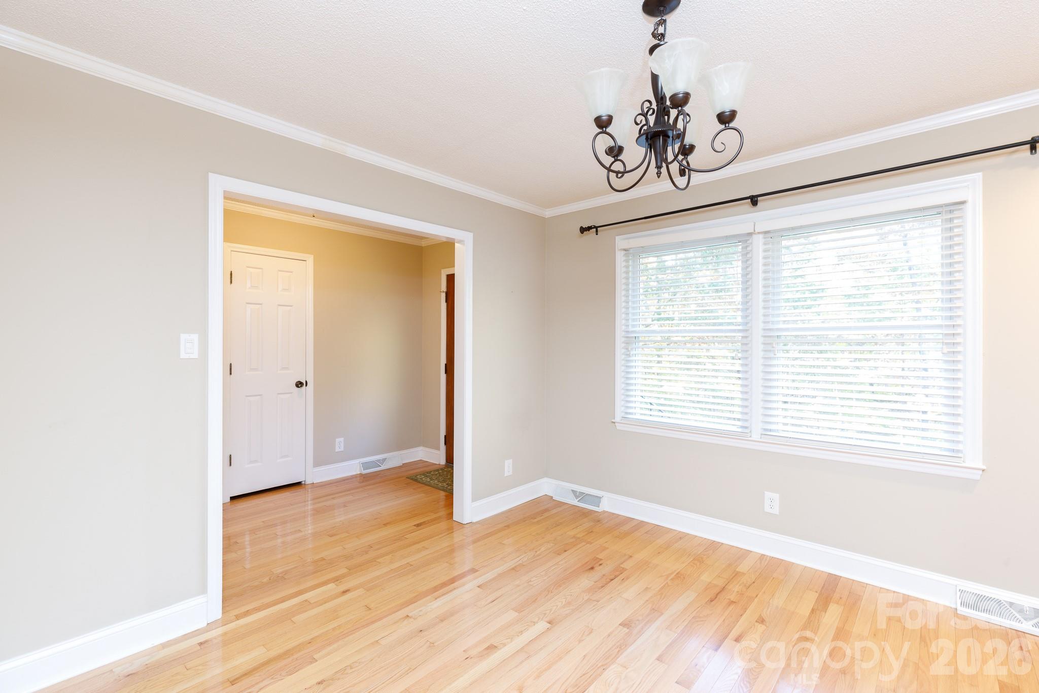4193 Walker Road Rock Hill, SC 29730 - Photo 7 of 38 a view of an empty room with wooden floor and a window