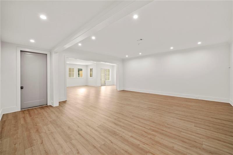 1074 Moores Mill Road Northwest Atlanta, GA 30327 - Photo 38 of 68 a view of a room with wooden floor and window