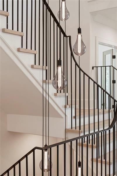 1074 Moores Mill Road Northwest Atlanta, GA 30327 - Photo 41 of 68 a view of staircase with railing and white walls
