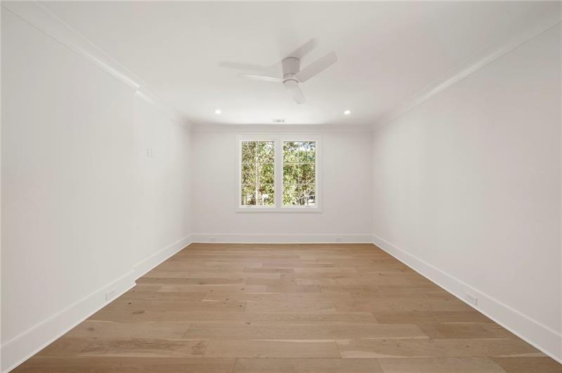 1074 Moores Mill Road Northwest Atlanta, GA 30327 - Photo 50 of 68 an empty room with windows
