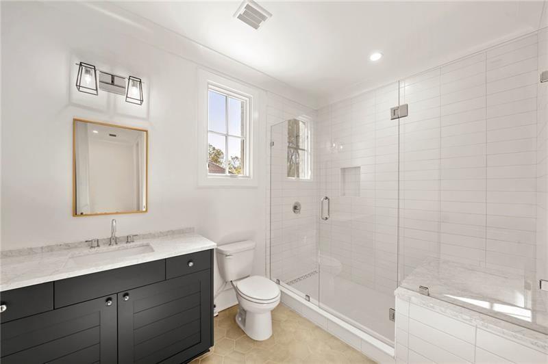 1074 Moores Mill Road Northwest Atlanta, GA 30327 - Photo 51 of 68 a bathroom with a double vanity sink toilet and shower