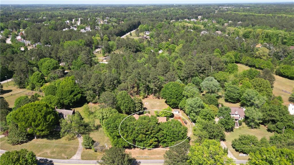 130 Hawn Road Fayetteville, GA 30215 - Photo 55 of 67 an aerial view of residential house with outdoor space and trees