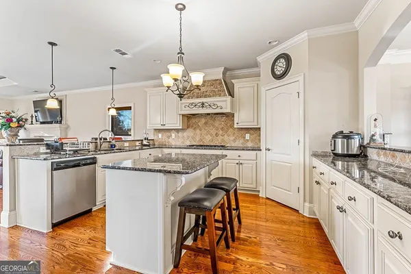 a view of a livingroom with walk in closet and bathroom