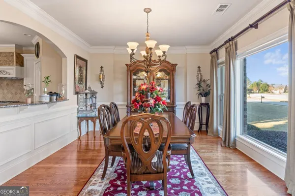 a living room with furniture fireplace and flat screen tv