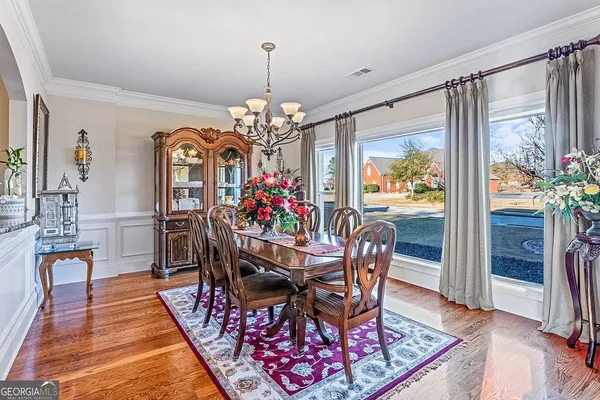 a living room with furniture fireplace and a flat screen tv