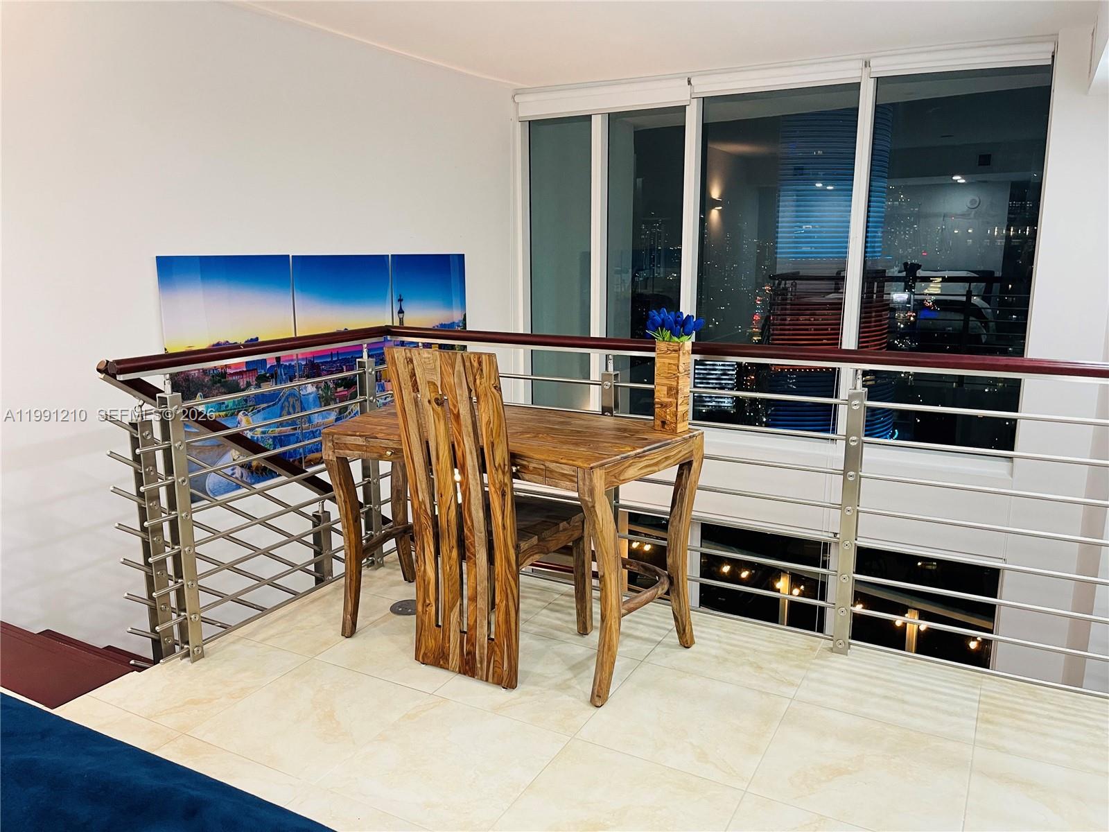 41 Southeast 5th Street, Unit 2305 Miami, FL 33131 - Photo 12 of 56 an outdoor living and dining room