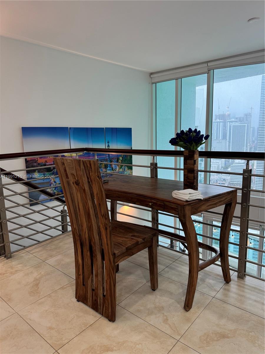 41 Southeast 5th Street, Unit 2305 Miami, FL 33131 - Photo 13 of 56 a view of a dining room with furniture