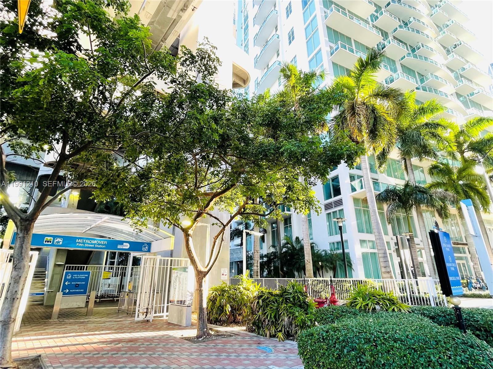 41 Southeast 5th Street, Unit 2305 Miami, FL 33131 - Photo 2 of 56 a view of a white house with a tree and plants