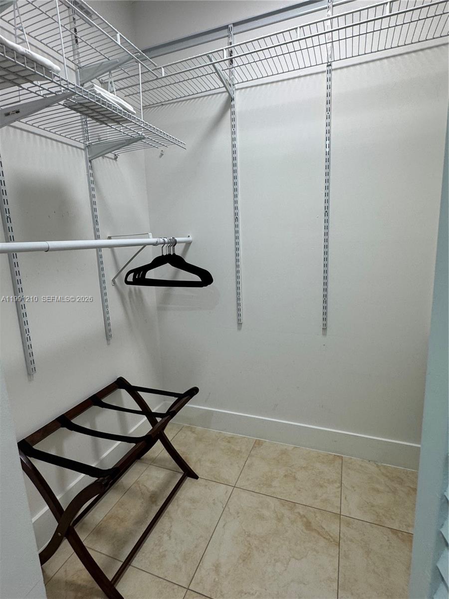 41 Southeast 5th Street, Unit 2305 Miami, FL 33131 - Photo 21 of 56 a picture of a room with racks on the wall