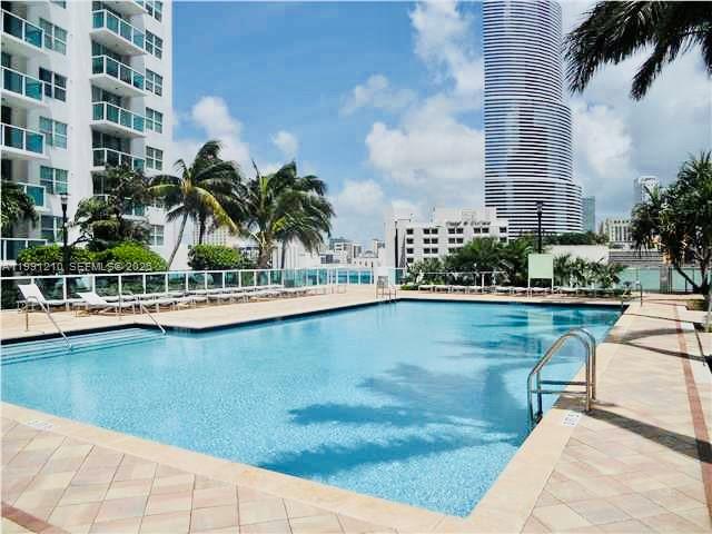 41 Southeast 5th Street, Unit 2305 Miami, FL 33131 - Photo 50 of 56 a view of a swimming pool with a patio