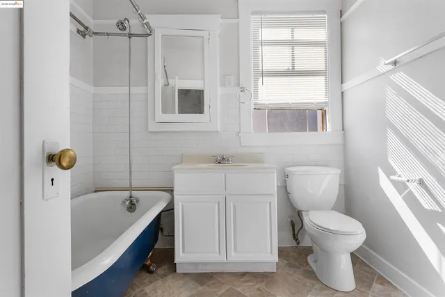 a bathroom with a toilet sink and a bathtub