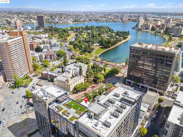 an aerial view of a city with ocean view