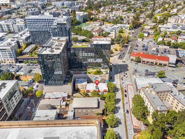 an aerial view of residential house with outdoor space and parking