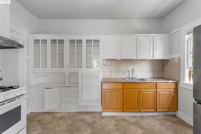 a kitchen with a sink and cabinets