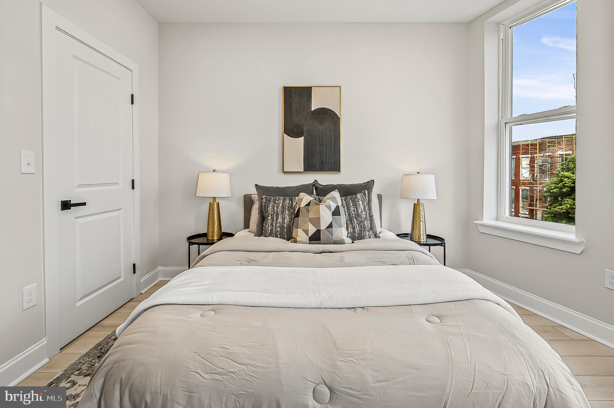 539 East 23rd Street Baltimore, MD 21218 - Photo 10 of 29 a bedroom with a bed and window