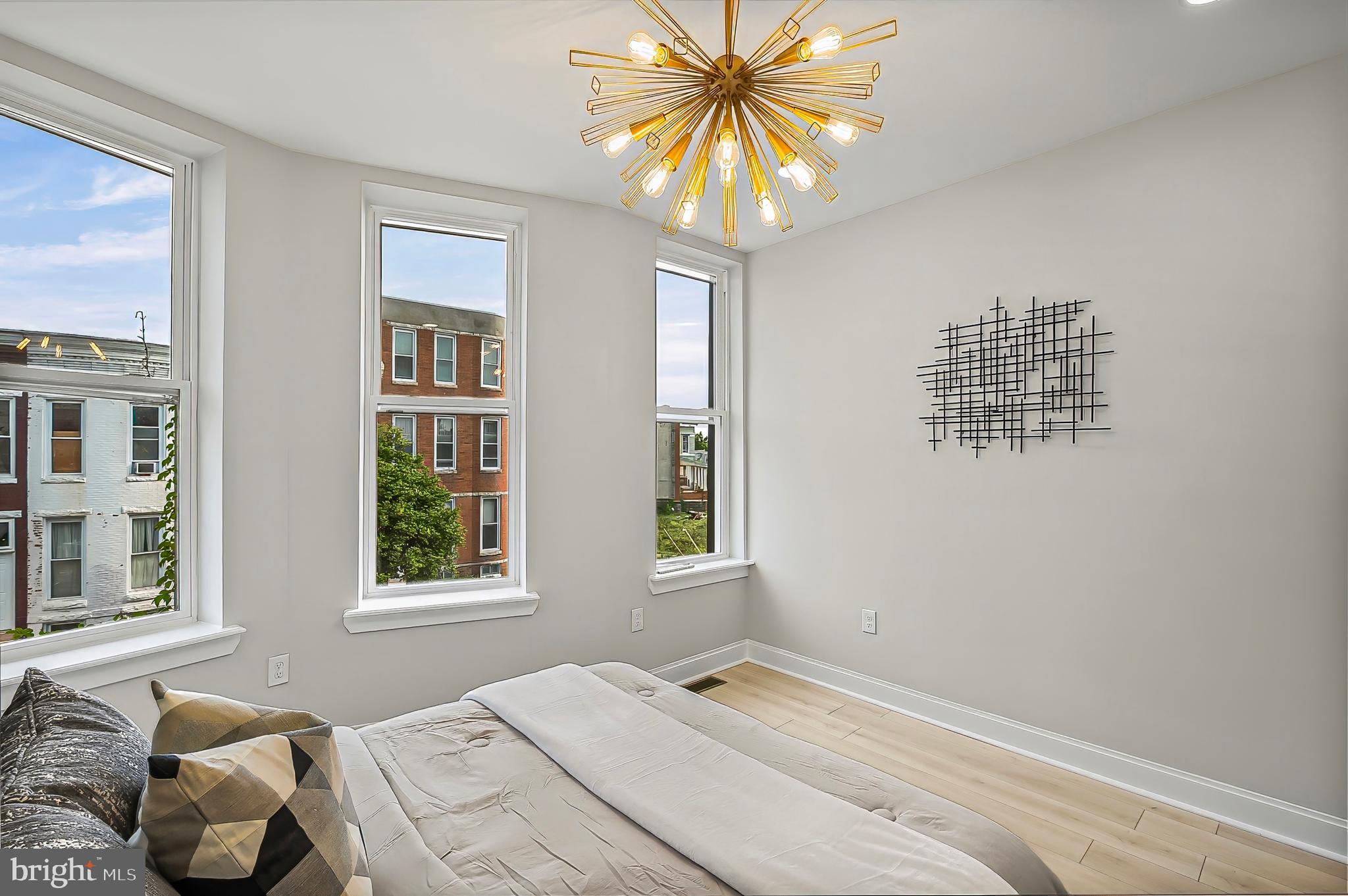 539 East 23rd Street Baltimore, MD 21218 - Photo 11 of 29 a bedroom with a bed and a window
