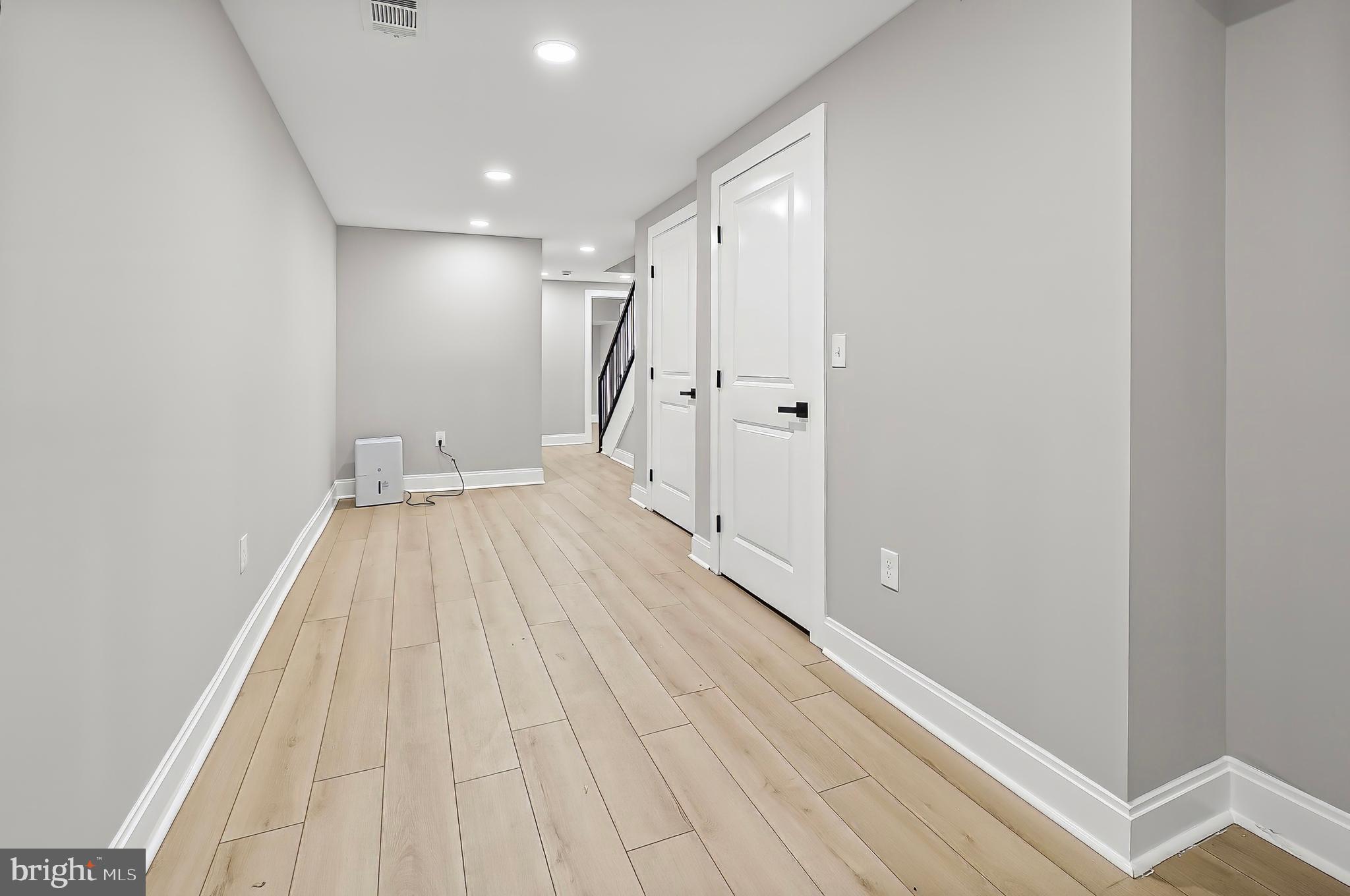 539 East 23rd Street Baltimore, MD 21218 - Photo 20 of 29 a view of a hallway with wooden floor